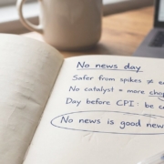No news days – trading journal page Open trading journal on a wooden desk with handwritten notes under the heading "No news day": safer from spikes is not easier to trade, no catalyst means more chop, be careful the day before CPI.